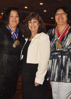 Mrs. Marisa Fordunski (c.) pose with two of her top students: Wanda Barrera (l.) and Razia Razark (r.)  